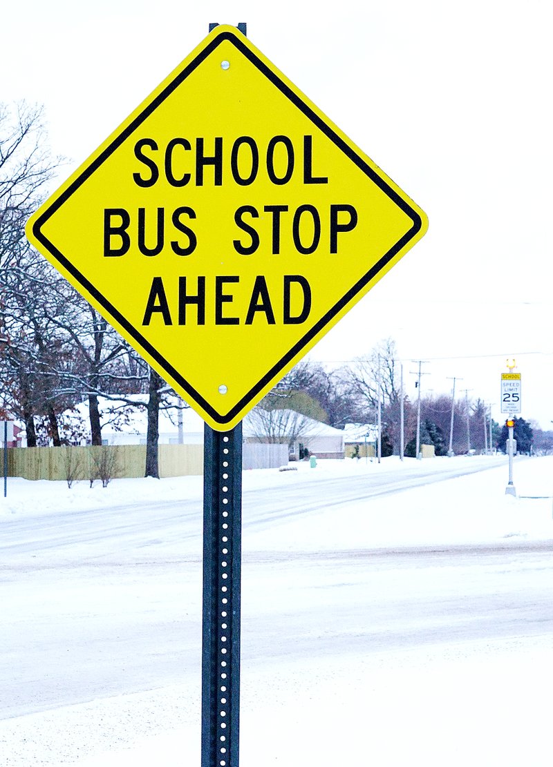 Roads, including Pioneer Lane in front of Gentry schools, were snow packed and icy on Monday morning, resulting in the decision to cancel Monday classes in area school districts.