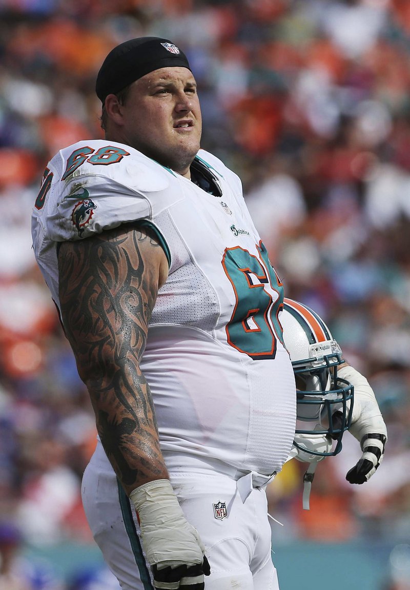 FILE - In this Sunday, Dec. 23, 2012 file photo, Miami Dolphins guard Richie Incognito (68) looks on during the first half of an NFL football game against the Buffalo Bills in Miami. The Buffalo Bills have agreed in principle to sign Richie Incognito, the offensive guard who has been out of football since 2013 after being one of the central figures in the Miami Dolphins' bullying scandal, Saturday, Feb. 7, 2015. 