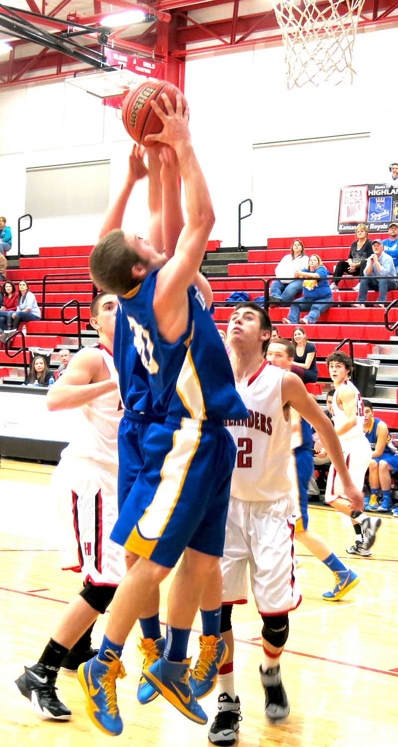 Photo by Mike Eckels Decatur&#8217;s Kyle Shaffer (#30) goes for a jumper during the Bulldog-Highlander game in Eureka Springs Feb. 10. Decatur took the game, 62 to 38.