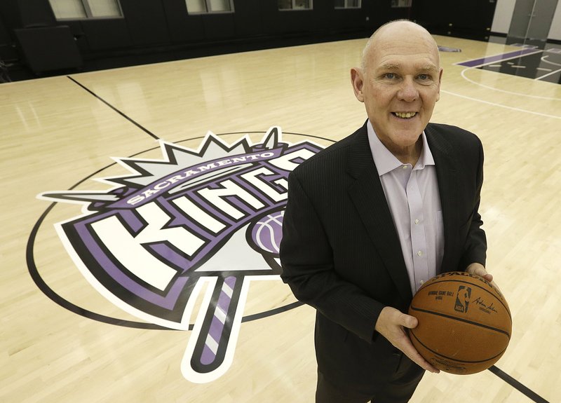 George Karl poses for a photo at the Sacramento Kings practice facility after he was introduced as the teams new head coach at a news conference in Sacramento, Calif., Tuesday, Feb. 17, 2015.  Karl becomes the team's third head coach this season, replacing Tyrone Corbin who took over the team after Michael Malone was fired last December.