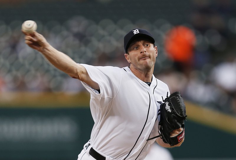 Detroit Tigers pitcher Max Scherzer throws against the Minnesota Twins in the first inning of a baseball game in Detroit Thursday, Sept. 25, 2014. 
