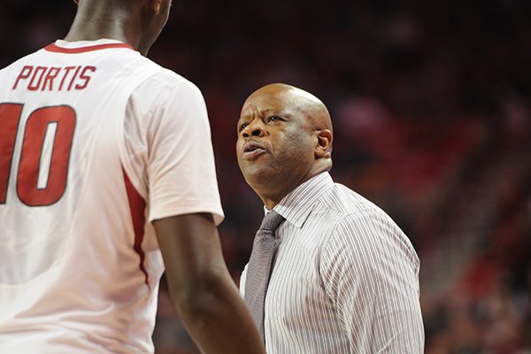 Arkansas coach Mike Anderson talks with Bobby Portis during a game Wednesday, Feb. 18, 2015, at Bud Walton Arena in Fayetteville. 