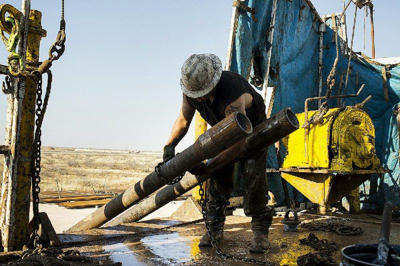 A roughneck works on an oil rig in the Permian basin outside Midland, Texas, in December. Oil traders have recently taken a keen interest in the Baker Hughes Inc. weekly survey of the number of operating drilling rigs in the United States. 