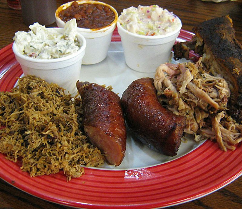 The Sampler Platter at Grandpa’s Bar-B-Que in Cabot comes with a rib, pork, beef and sausage, with three sides and Texas toast. 