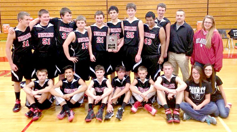 COURTESY PHOTO The McDonald County eighth grade boys basketball team defeated Cassville to win the Big 8 Conference Basketball Tournament held last week in Aurora.