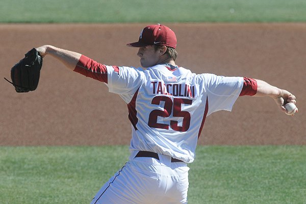 Arkansas sophomore Dominic Taccolini throws a pitch during a game against North Dakota on Saturday, Feb. 14, 2015, at Baum Stadium in Fayetteville. 