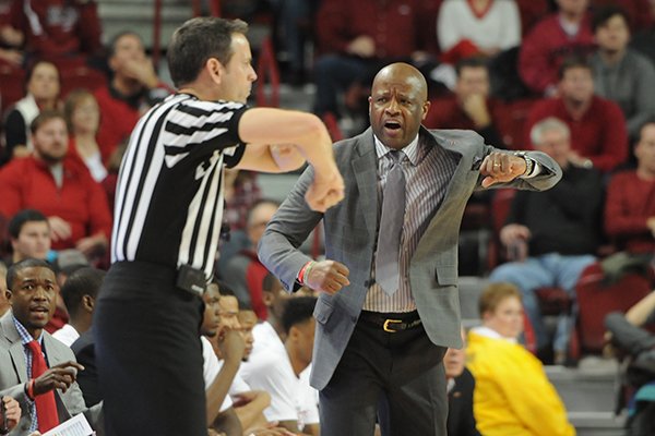 Arkansas coach Mike Anderson gestures toward an official during a game Wednesday, Feb. 18, 2015, at Bud Walton Arena in Fayetteville. 