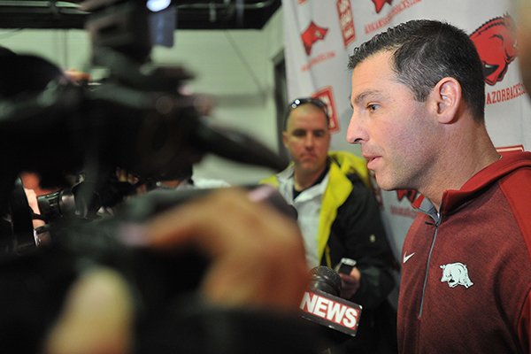 Arkansas offensive coordinator Dan Enos speaks to reporters on Wednesday, Feb. 5, 2015, at the Fred W. Smith Center in Fayetteville. 