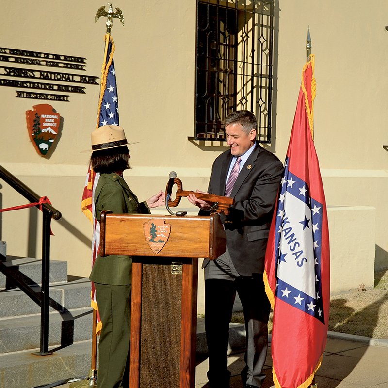 The Sentinel-Record/Mara Kuhn OFFICE KEY: U.S. Rep. Bruce Westerman, R-District 4, accepts a symbolic key from Hot Springs National Park Superintendent Josie Fernandez Thursday afternoon as he officially opened his office in the HSNP Administration Building.