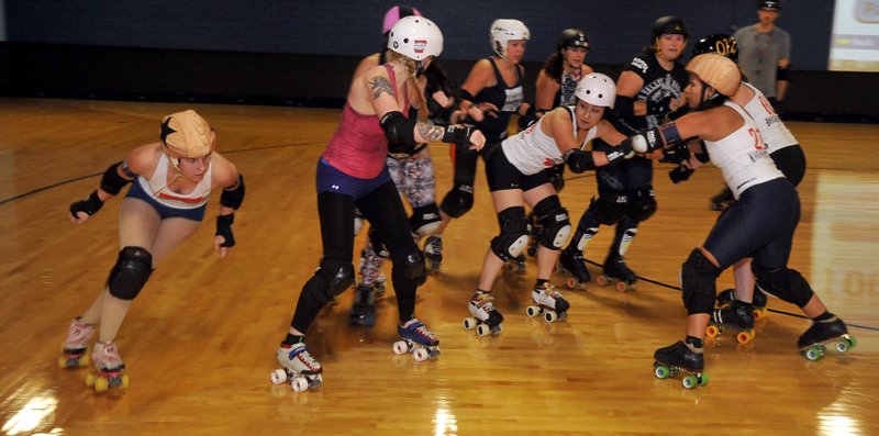 File Photo Roller derby team members run drills during a previous practice at Starlight Skatium.