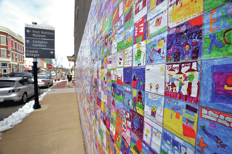 NWA Democrat-Gazette/BEN GOFF The Wal-Art mural created by Bentonville elementary school students decorates the side of the Tate and Haney Building on South Main Street in Bentonville. The mural is slated to be removed in coming weeks.