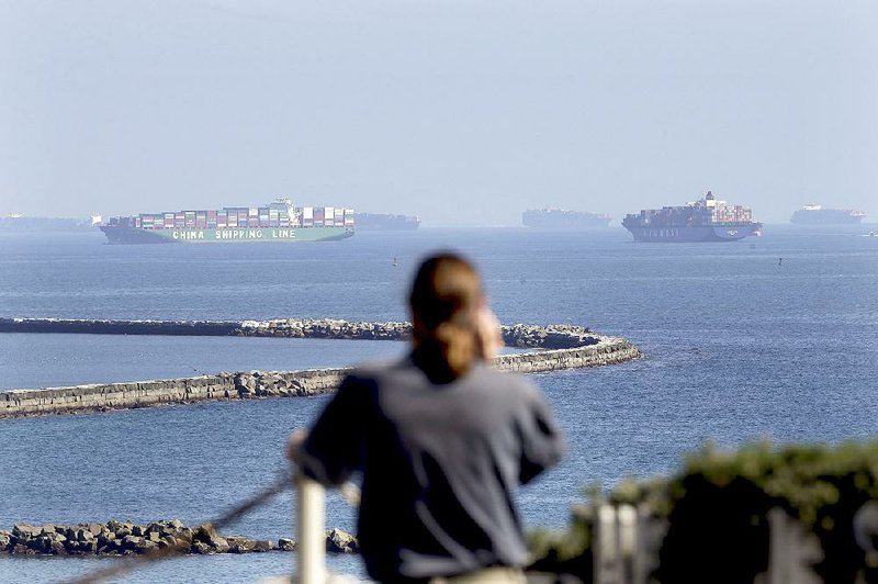 Container ships anchor near the Port of Long Beach in California on Tuesday, waiting for berths to clear so they can be unloaded. 
