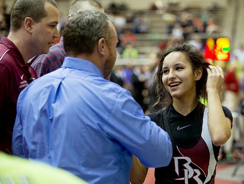 Beebe's Destiny Munez greets staff after winning her bout for the 106 lb weight class State Wrestling Championship at Jack Stephens Center February 21, 2015. 
