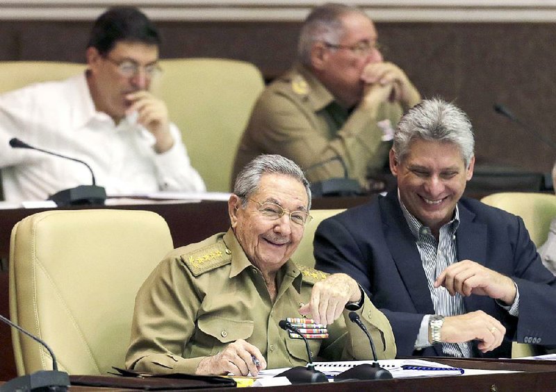 Cuban President Raul Castro (left) and Miguel Diaz-Canel, first vice president, attend a twice-annual legislative session in December in Havana. Diaz-Canel has taken pains not to steal the limelight from Castro or the president’s 88-year-old brother, Fidel. 