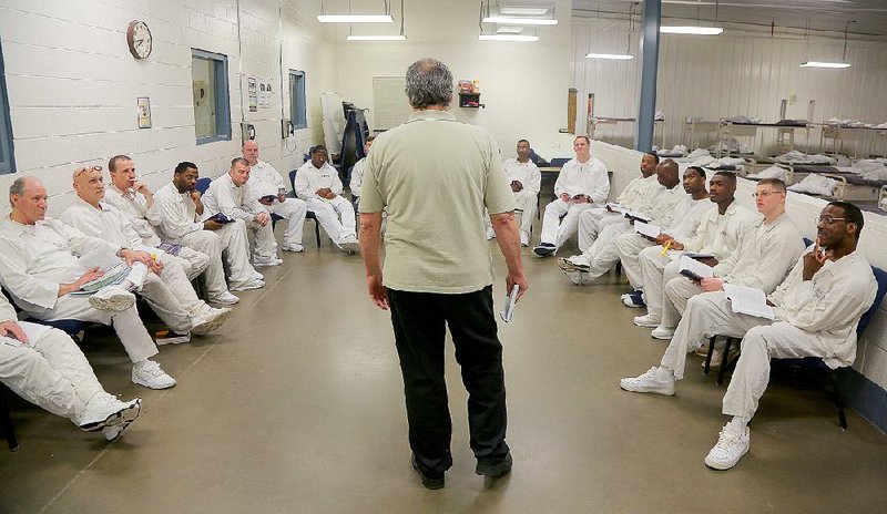 Instructor Michael Stuckey (center) leads a discussion in his group mentoring class in the Prison Fellowship program at the Arkansas Department of Correction’s Wrightsville Unit in this Feb. 19, 2015, file photo.