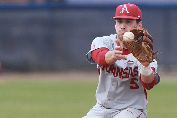 Arkansas short stop Brett McAfee fields a ball during a game against Maryland on Sunday, Feb. 22, 2015, at Stanky Field in Mobile, Ala. 