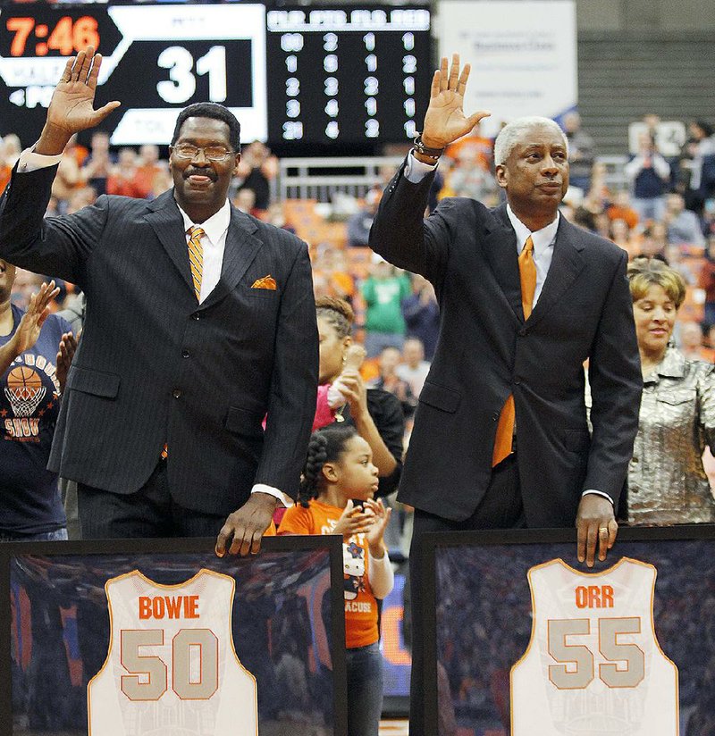 Syracuse basketball recently honored program greats Roosevelt Bouie (left) and Louis Orr (right) but made a glaring error by misspelling Bouie’s name on his jersey. 