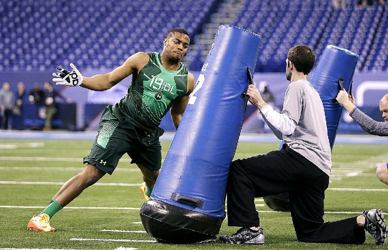 Arkansas defensive lineman Trey Flowers went 10-1 in the broad jump, had a time of 12.03 seconds in the 60-yard shuttle, lifted 225 pounds 28 times and ran the 40-yard dash in 4.93 seconds at the NFL combine. 