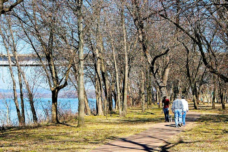Fort Smith walkers enjoy the River Trail at Belle Point. 