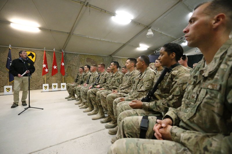 U.S. Defense Secretary Ash Carter, left, holds a question and answer session with soldiers at Kandahar Airfield in Afghanistan, Sunday, Feb. 22, 2015. Carter is making his first trip to visit troops and commanders in Afghanistan since his swearing-in this week.