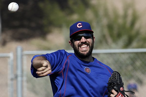 Chicago Cubs’ Blake Parker throws during a spring training baseball workout Saturday, Feb. 21, 2015, in Mesa, Ariz. (AP Photo/Morry Gash)