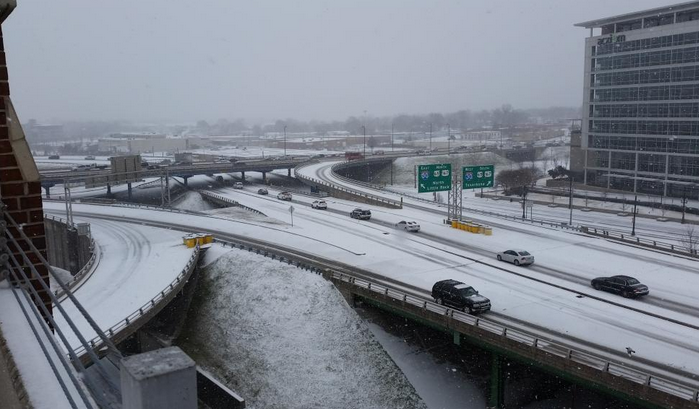 Snow covers the Interstate 30 on- and off-ramps in downtown Little Rock Monday.