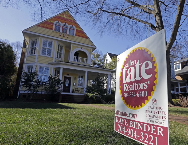This Jan. 8, 2015 photo shows a home for sale in Charlotte, N.C. The National Association of Realtors reports on sales of existing homes in January on Monday, Feb. 23, 2015.