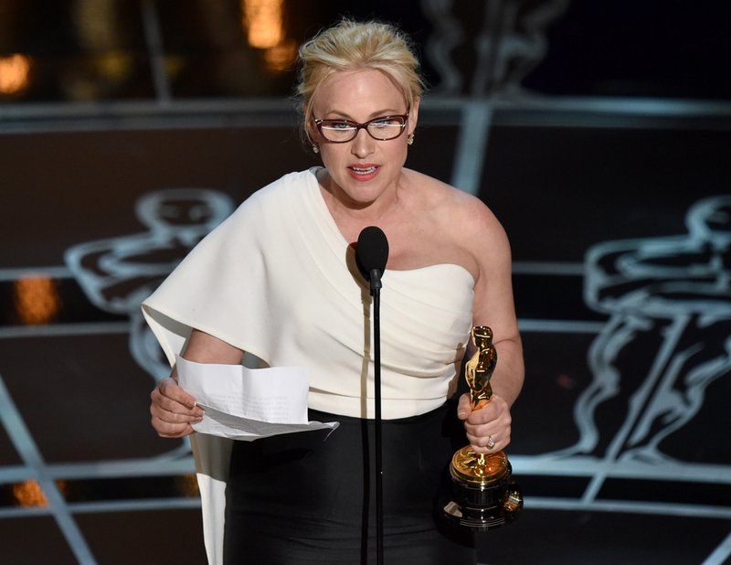 Patricia Arquette accepts the award for best actress in a supporting role for Boyhood at the Oscars on Sunday, Feb. 22, 2015, at the Dolby Theatre in Los Angeles.