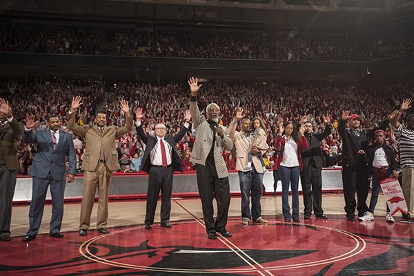 Former Arkansas head coach Nolan Richardson calls the hogs during halftime after receiving a replica of his banner Tuesday, Feb. 24, 2015, at Bud Walton Arena in Fayetteville.