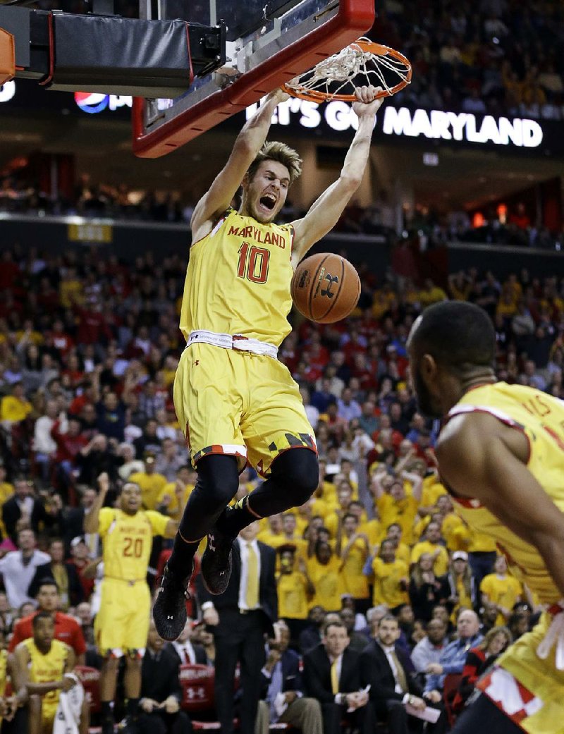 Maryland forward Jake Lawman dunks during the second half of the Terrapins’ 59-53 victory over No. 5 Wisconsin on Tuesday night in College Park, Md. 