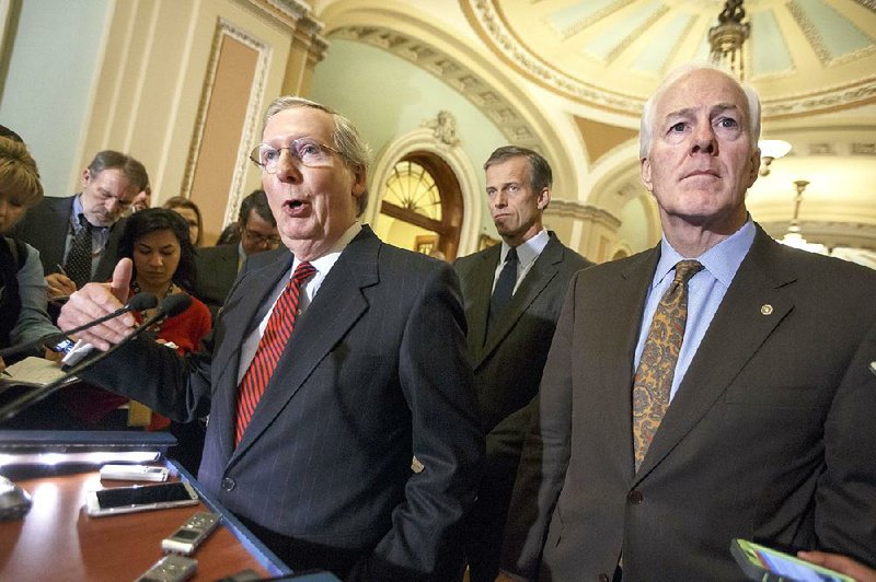 Senate Majority Leader Mitch McConnell, R-Ky., joined by Majority Whip John Cornyn, R-Texas, right, and Sen. John Thune, R-S.D., rear, talks about his move to disentangle one of two contested immigration measures from the Homeland Security budget and debate the issues separately, as the Senate faces an impasse over provisions attached to the spending bill aimed at blocking President Barack Obama's executive actions on immigration, at the Capitol in Washington, Tuesday, Feb. 24, 2015.  “I don’t know what’s not to like about this,” Senate Majority Leader Mitch McConnell said Tuesday of his plan to keep the Department of Homeland Security up and running. 