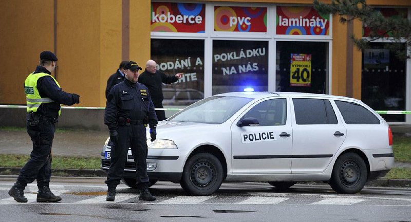 Police secure the area near the restaurant where a gunman killed eight people before killing himself in Uhersky Brod, eastern Czech Republic, on Tuesday. 