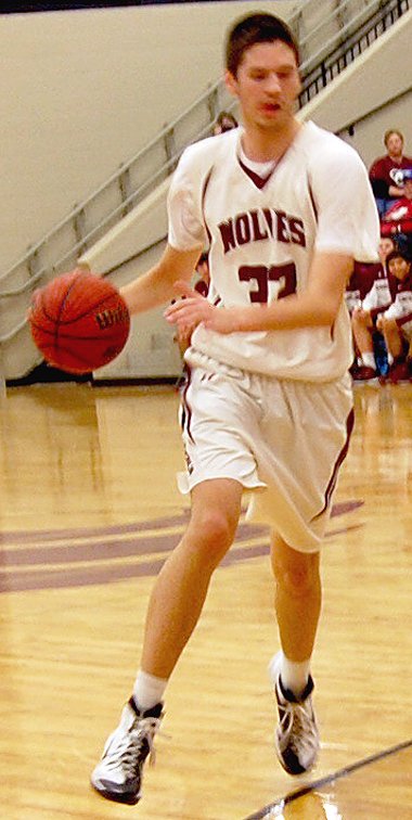 BEN MADRID ENTERPRISE-LEADER Lincoln senior Shandon &#8220;Biggie&#8221; Goldman drives against Prairie Grove. Goldman scored 24 points to lead the Wolves past the Tigers, 50-38, in a regular season finale on Feb. 13.