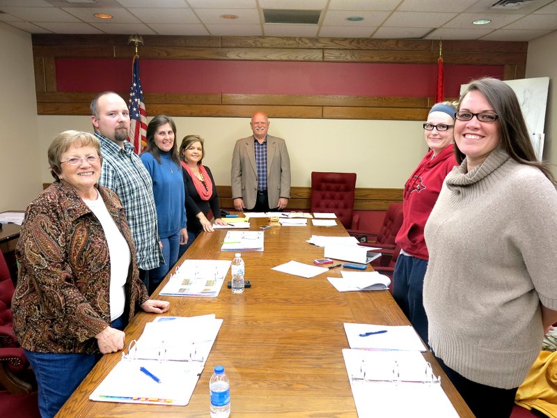 Photo by Mike Eckels The Decatur City Council pose before their Feb. 16 meeting at city hall. The council consist of Linda Marin (left), James Jessen, Sandy Duncan, Kim Wilkins (city clerk), Mayor Bob Tharp, Robin Heath, and Ladale Clayton. Missing from the Feb. 16 meeting is David Sutton.