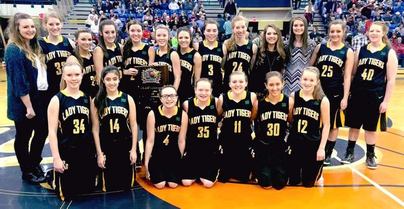BEN MADRID ENTERPRISE-LEADER The Prairie Grove girls basketball team celebrated their fourth straight District 4A-1 tournament championship with a 42-39 victory over Huntsville on Saturday.