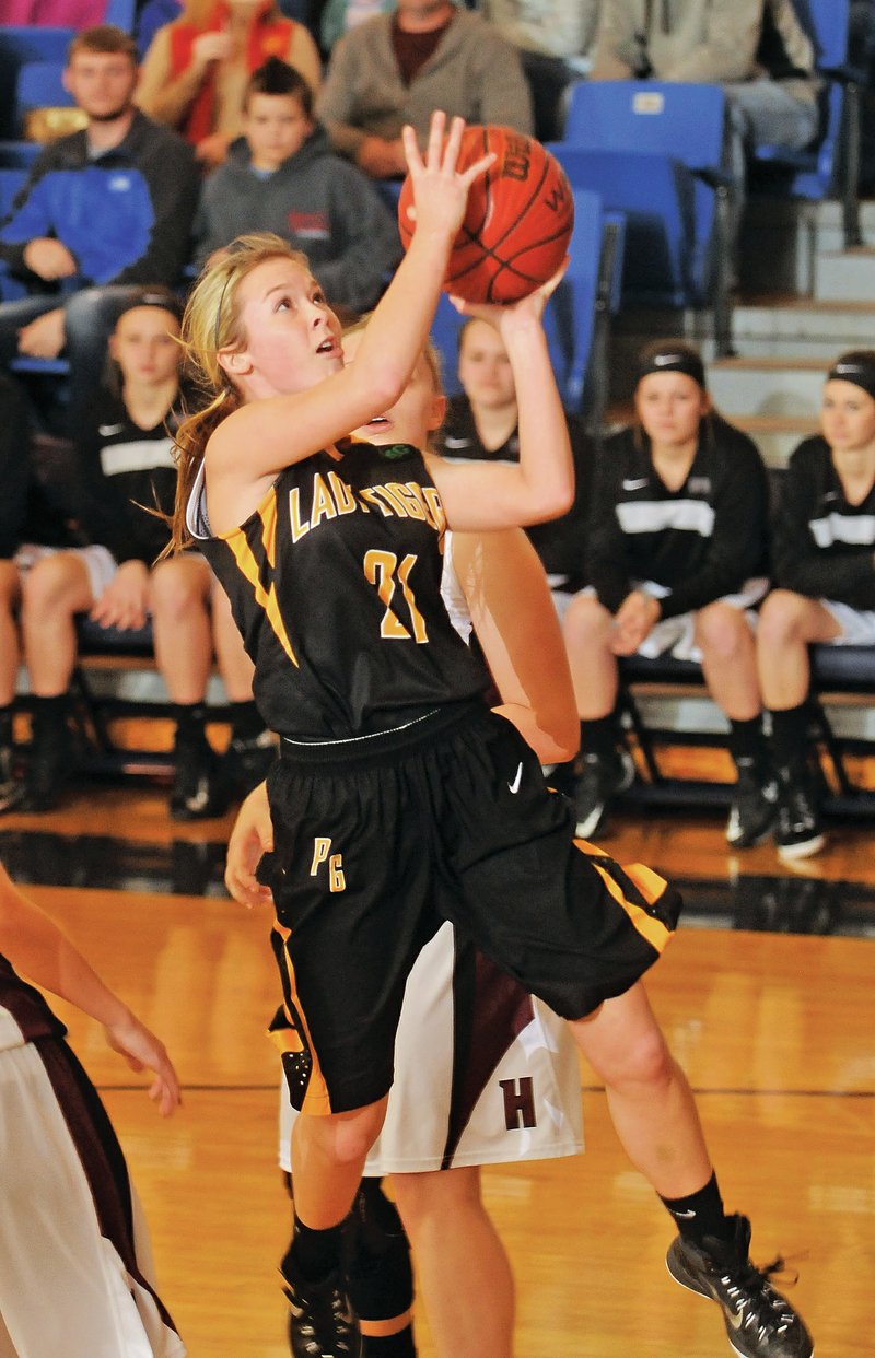 Taylor Hartin, Prairie Grove junior, drives to the basket Saturday against Huntsville in the 4A-1 District Tournament championship game at Shiloh Christian in Springdale. The Lady Tigers are the No. 1 seed in the 4A-North Regional Tournament and take on Arkansas Baptist today at 4 p.m. in Pottsville.