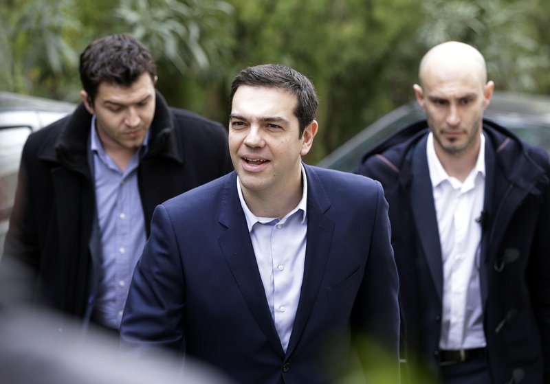 Greece's Prime Minister Alexis Tsipras arrives for a meeting with Greek composer Mikis Theodorakis in Athens, Tuesday, Feb. 24, 2015. Caught between its own defiant campaign pledges and pressure from creditors, Greece's left-wing government will deliver a list of reforms Tuesday to debt inspectors for final approval of extended rescue loans, officials said. 