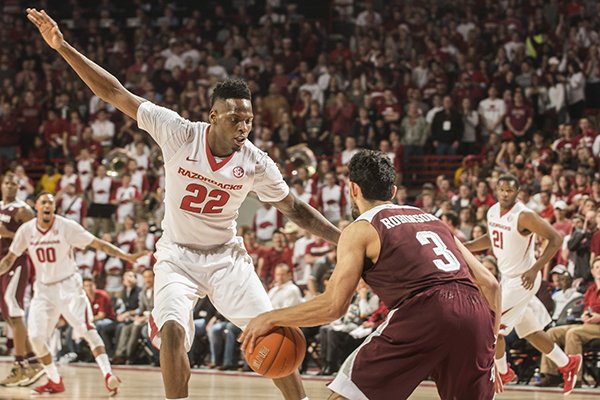 Arkansas forward Jacorey Williams defends Texas A&M guard Alex Robinson in the first half Tuesday, Feb. 24, 2015, at Bud Walton Arena in Fayetteville.