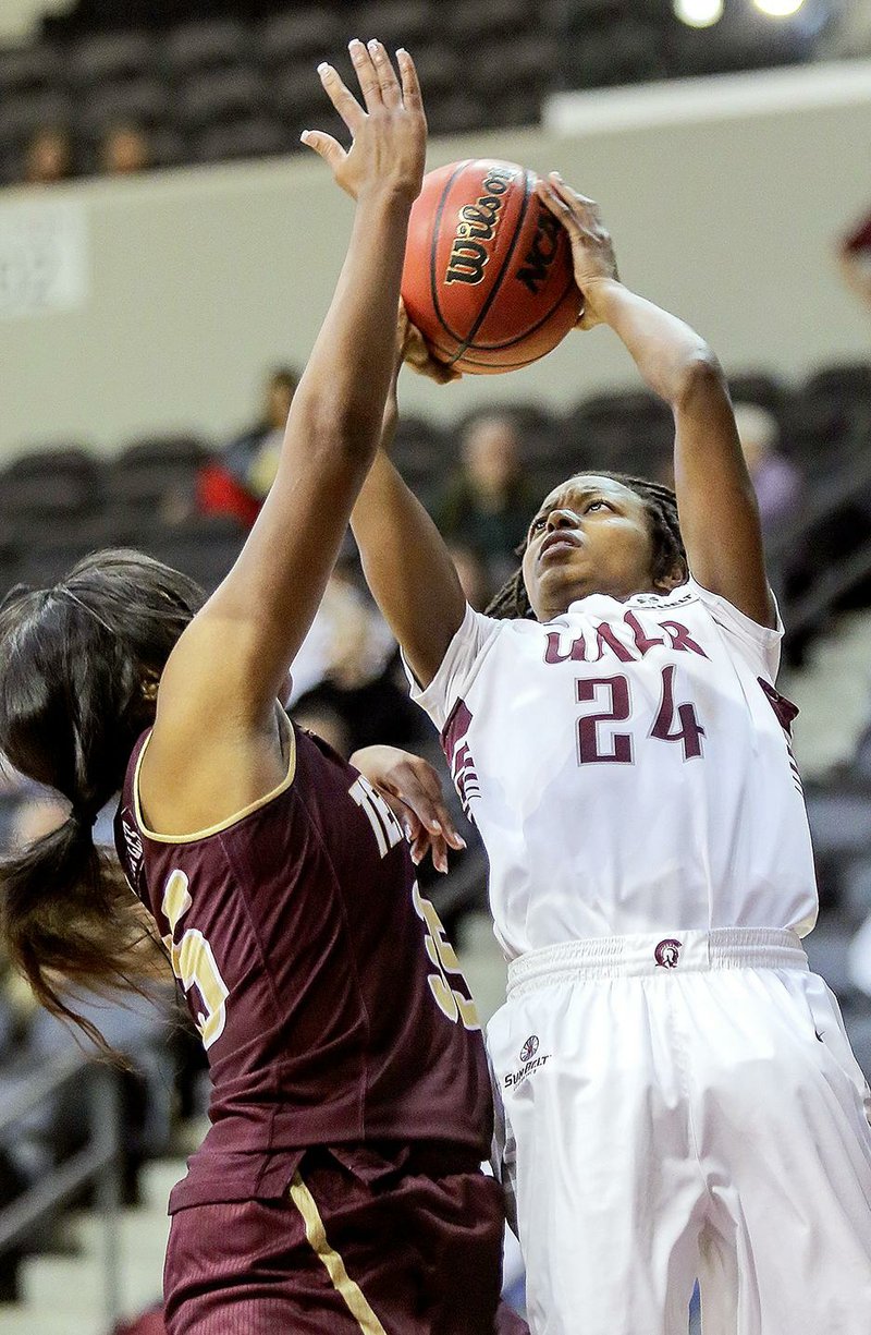 UALR senior Taylor Gault (24) probably will be remembered by Trojans fans for her scoring ability, but she is leaving the school as a complete player. 