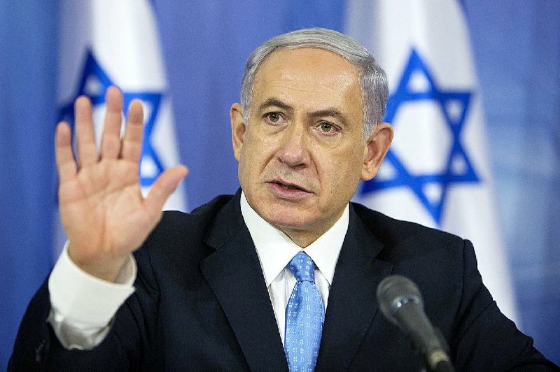 Israeli Prime Minister Benjamin Netanyahu speaks to the media during a press conference at the defense ministry in Tel Aviv, Israel, Saturday Aug. 2, 2014. 