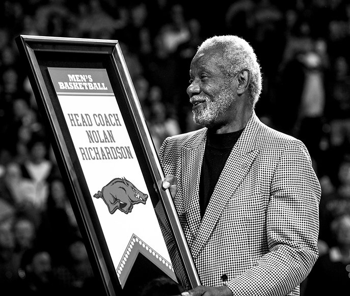 NWA Democrat-Gazette/Anthony Reyes HONORING COACH: Former Arkansas men's basketball coach Nolan Richardson receives a standing ovation from the Walton Arena crowd as he is honored Tuesday night during a halftime ceremony in Fayetteville. Richardson coached the Razorbacks to the 1994 NCAA championship and two other Final Four appearances.