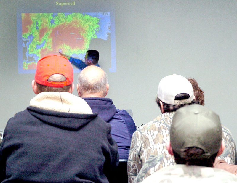 RICK PECK MCDONALD COUNTY PRESS Doug Cramer, from the National Weather Service in Springfield, points out a hook echo in the supercell thunderstorm that produced an EF-5 tornado that hit Joplin in 2011.