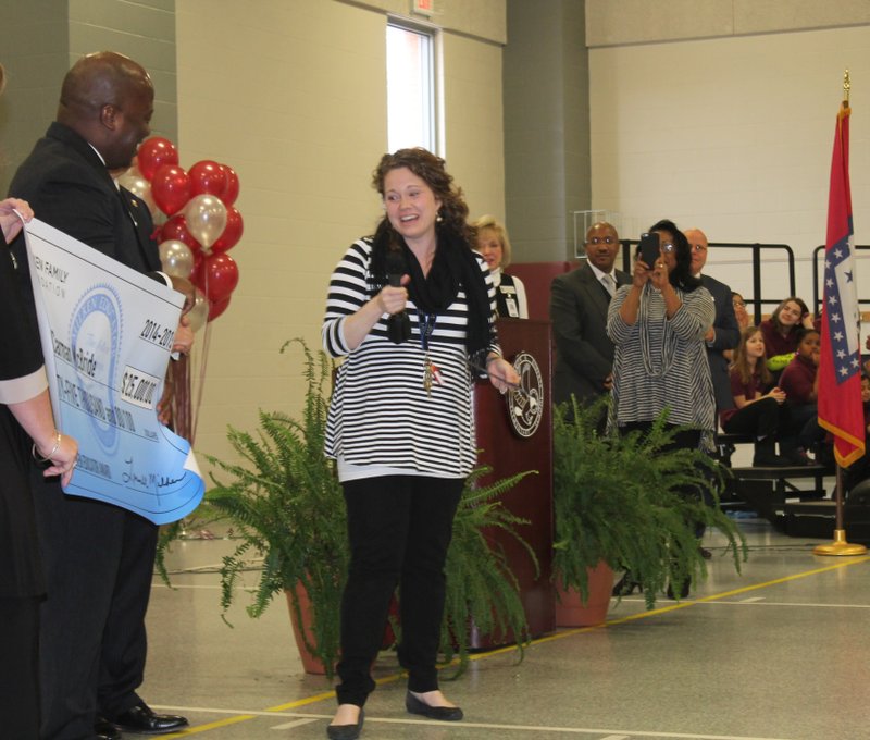 Carman McBride, EAST facilitator at Don R. Roberts Elementary school, receives a $25,000 check along with the Milken educator award. 