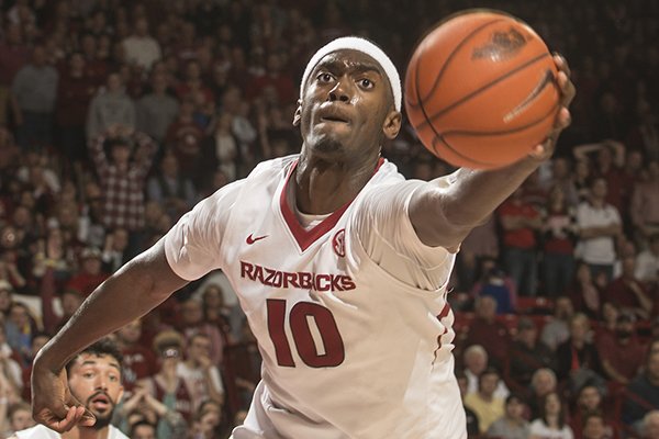 Arkansas sophomore Bobby Portis grabs a rebound against Texas A&M in the second half Tuesday, Feb. 24, 2015, at Bud Walton Arena in Fayetteville. 