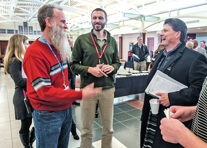 Merv Fleshman, recreation manager for the Jones Center (from left), laughs Thursday with Michael Kirk, director of recreation & fitness, and Russell Tooley, chairman of the Jones Center board, after a news conference announcing a donation to the Jones Center endowment campaign. Johnelle Hunt made a donation which helped to hit the endowment campaign to raise $30 million for the center’s trust. For photo galleries, go to nwadg.com/photos.