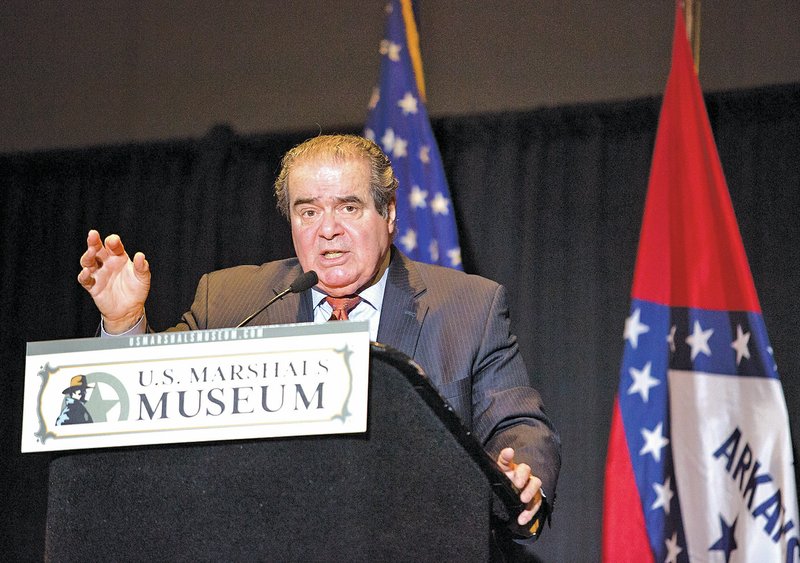 U.S. Supreme Court Justice Antonin Scalia speaks Thursday at the Fort Smith Convention Center as the first of three speakers in the Winthrop Paul Rockefeller Distinguished Lecture Series, designed to highlight the work of the U.S. Marshals Service with each branch of government.