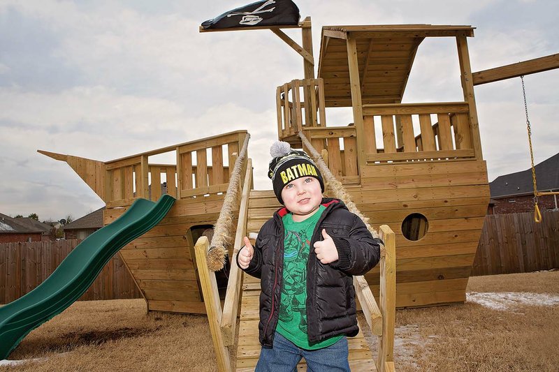 Keagan Provost, 5, of Conway pauses to give two thumbs up after he comes down from the crow’s nest of the pirate ship in his backyard. The ship was built in two days by the Make-A-Wish Foundation. Keagan was diagnosed with an ependymoma brain tumor when he was 13 months old, and he has had three recurrences of the disease. He also has a tumor on his spine, and he undergoes daily radiation treatments. His mother said he is always positive. “I hope one day I can be as strong as him because he’s awesome,” she said.