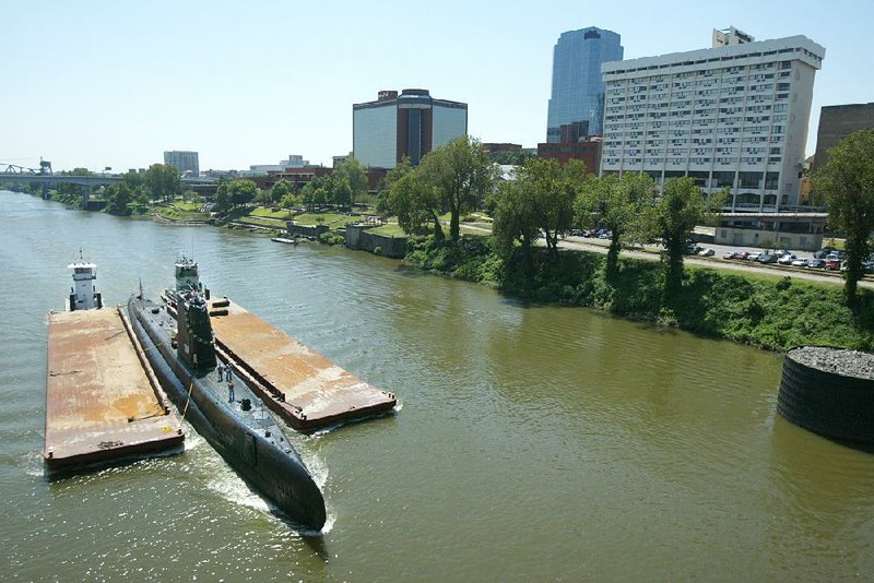 The USS Razorback arrives on Aug. 6, 2004. The sub will be transferred to the lake at MacArthur Park when the Arkansas Arts Center moves to North Little Rock.
