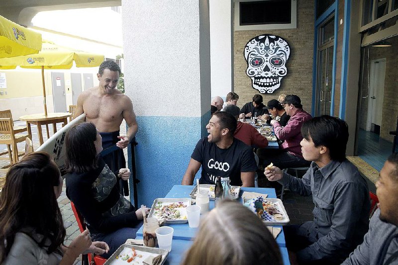 Diners chat at the U.S. Taco Co., owned by Taco Bell, in Huntington Beach, Calif., earlier this month. 