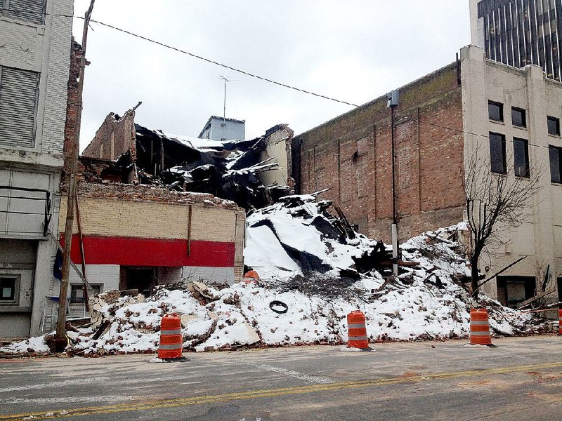 Ruins of another collapsed building litter Main Street in downtown Pine Bluff. 